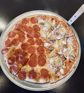Half Kozy Half Pepperoni pizza at Manoli’s Pizza Company in Wailea Maui with mozzarella and organic tomato sauce